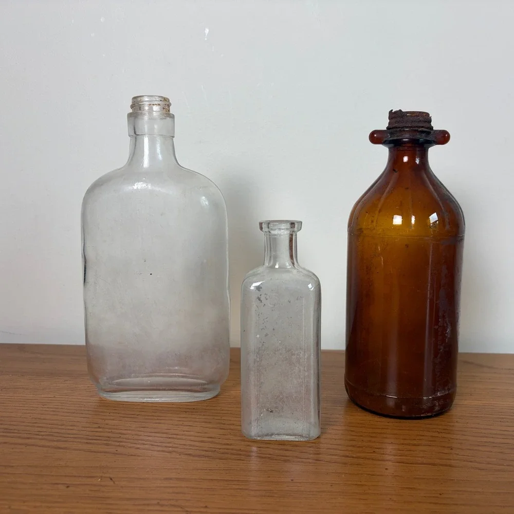 Vintage Glass Bottle Trio Amber and Clear Apothecary Medicine Bottles Set of 3